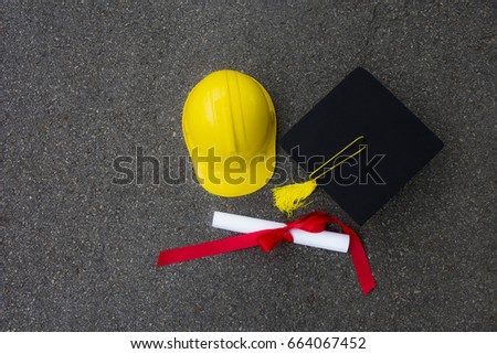 Hat and graduation certificate Put on the floor And  yellow engineer hat was put together. a Life after graduation will starting. Royalty-Free Stock Photo #664067452