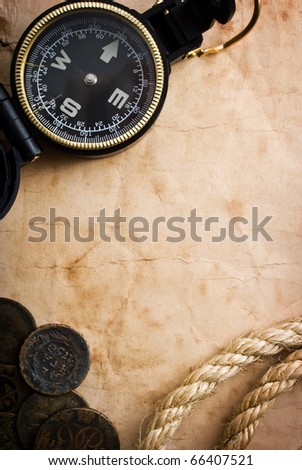 old compass and rope on grunge background