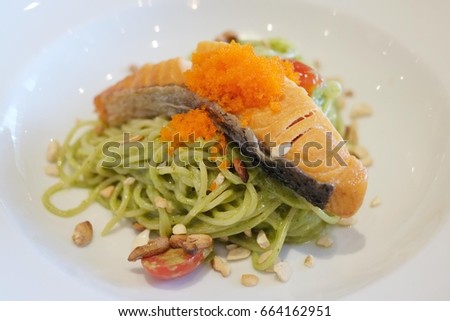 Thai spicy food. Spaghetti salmon. Spaghetti is a long, thin, cylindrical, solid pasta. It is a staple food of traditional Italian cuisine. Like other pasta, spaghetti is made of milled wheat.
