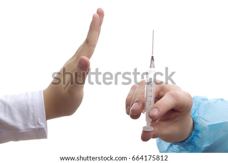 Hand of girl handing stop hand to doctor and refuse vaccination isolated on white background