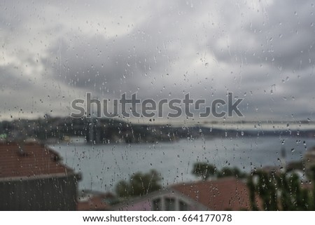 rain drops on window against city view of Istanbul, Turkey