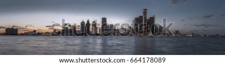 Detroit skyline at dusk with river
