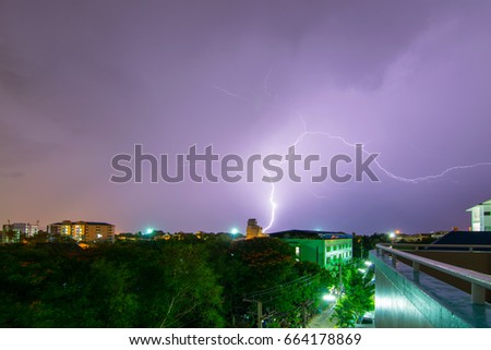 Lightning rain in the city center in the rainy season.