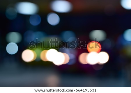 Blur street bokeh with colorful lights in night time for background usage,Bokeh from the fire of the car,Can be used for travel tasks.