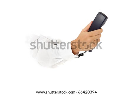 Hand of man breaking through a paper wall holding telephone receiver. Copy space. Studio shot. White background.
