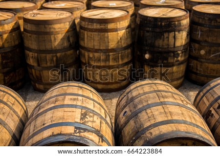 Rustic bourbon barrels at a Kentucky distillery on the Bourbon Trail.  Royalty-Free Stock Photo #664223884
