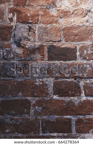 Texture of old red brick wall in vertical orientation. Using in art, design, interior,background, wallpapers.