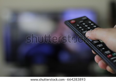 Binge watching the favourite TV show Royalty-Free Stock Photo #664283893