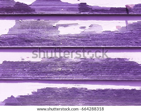 Light purple violet tinted weathered wall with peeling paint