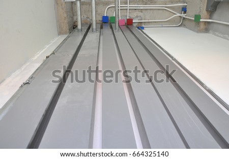 Metal wire way on wall for electrical cable wiring in building.