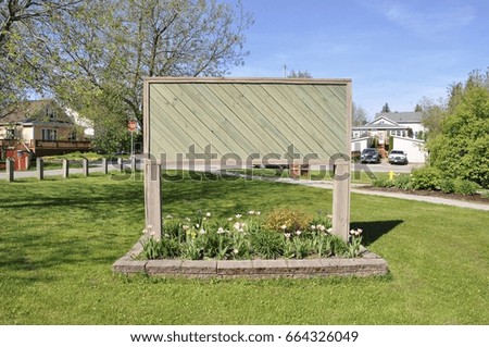 Blank wooden board in the garden