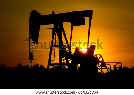 Oil Jack Silhouette With Sunset