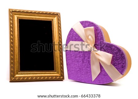 Gold frame and gift box on a white background