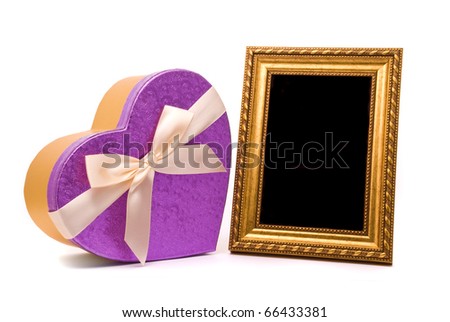 Gold frame and gift box on a white background