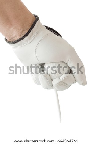 Action of golfer hand in white glove and the golf ball with tee ready to place on white background.