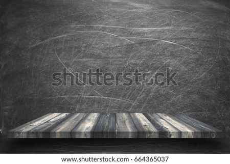 empty top wooden shelves with blackboard background, use for product display.