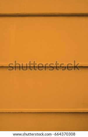 Orange concrete wall background with construction formwork lines