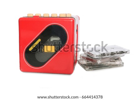 Retro red radio and cassette tapes on white background
