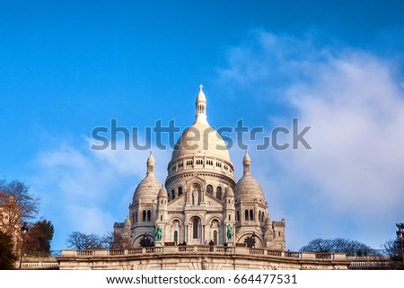 The Basilica Sacre Couer in Paris, France on a mostly clear day