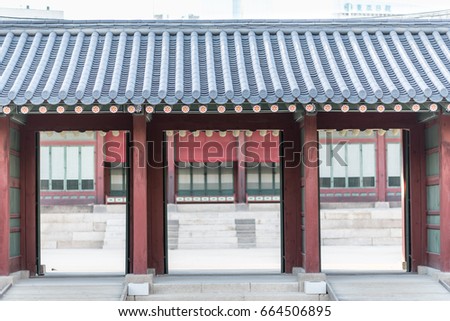 Korean traditional architecture - Korean Tradition Wooden Gate and red outdoor stone wall, decoration brick wall from ancient korean, Bukchon is unique place in Seoul, republic of Korea / south korea.