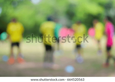 Abstract blurred group of football player in the field.