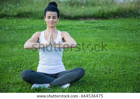 Yoga in the park, outdoor with effect light, health woman, Yoga woman. Concept of healthy lifestyle and relaxation.
