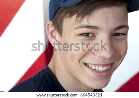 Portrait of a beautiful young man close-up on a bright background
