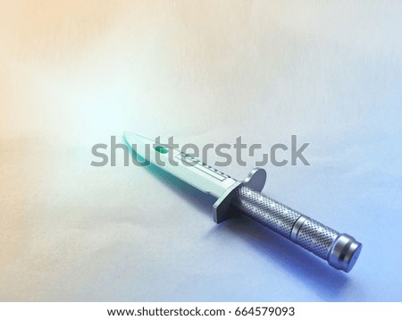 Plastic pen knives on a paper