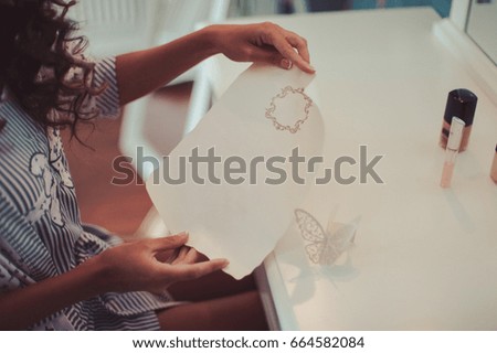 Girl with a sheet of paper
