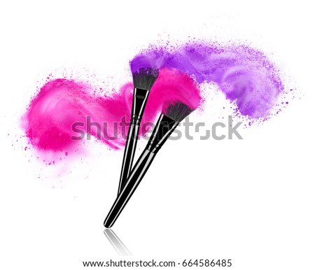 Make up brushes with powder splashes isolated on white background
