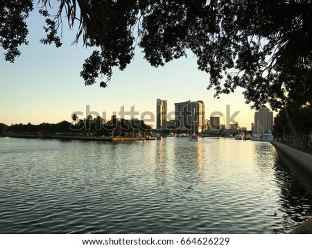 View of downtown St Petersburg, FL skyline at sunset from pier