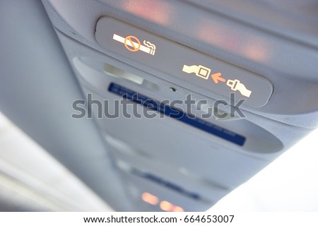 Security on a plane / Fasten Seat belt sign on a plane / No Smoking sign