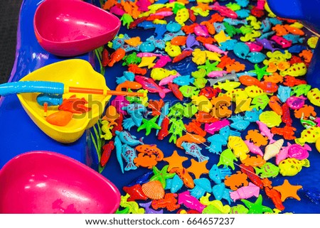 Many plastic fishes fishing game for kids.