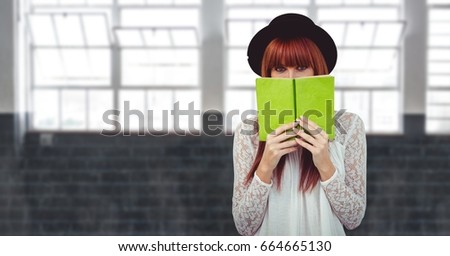Digital composite of Female hipster covering face with book