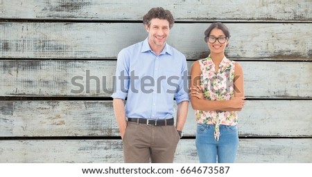 Digital composite of Confident business people standing against wooden wall