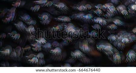 Beautiful background with different colored turtles, abstract background, animal shapes on black background