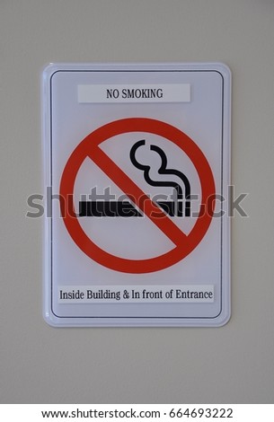 No smoking inside the building and in front of entrance sign