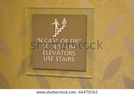 In case of fire don't use elevator - warning sign in a building