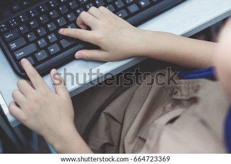 Boy press Ctrl C on keyboard