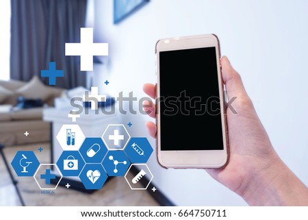 Hand woman holding smart phone at the hospital, Calling to nurse concept