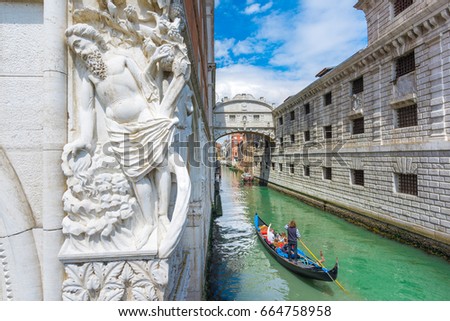 Gondole in chanel and whisper bridge of Venice, Italy.