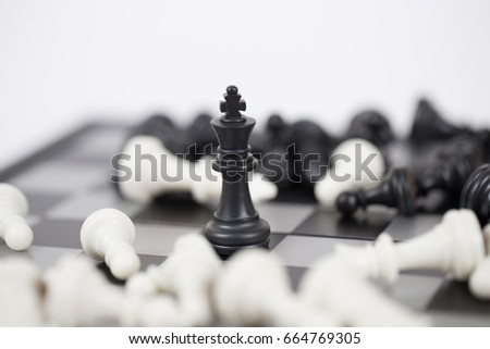 Chess is board game to improve thinking and strategy planning. Gold and silver chess on board in room for playing. Queen is winner. Woman power.