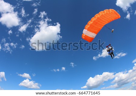 Tandem parachuting. Canopy in the sky. Royalty-Free Stock Photo #664771645