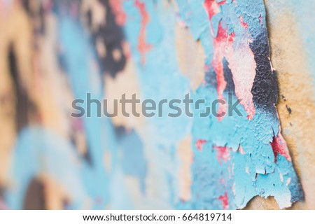 blurred textured wall with graffiti fragment, colorful abstract background
