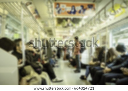 Blur image of Passenger on the subway in Japan with bokeh for background usage.