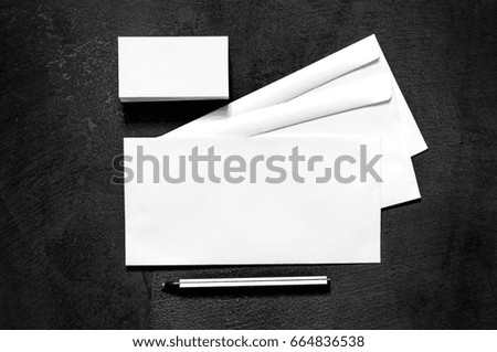 Blank stationery on a modern black concrete texture. Mock up for branding, graphic designers presentations and portfolios. Corporate identity template. Top view. 