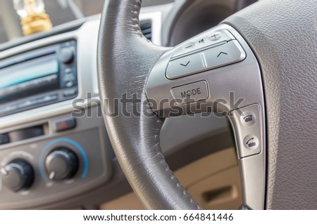 Cruise control button on the steering wheel, a system to facilitate the drive.