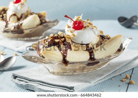 Sweet Homemade Banana Split Sundae with Chocolate Vanilla  Strawberry Ice Cream Royalty-Free Stock Photo #664843462
