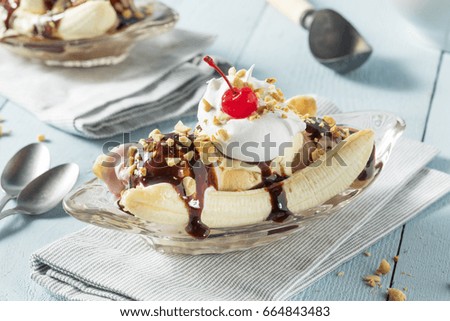 Sweet Homemade Banana Split Sundae with Chocolate Vanilla  Strawberry Ice Cream Royalty-Free Stock Photo #664843483