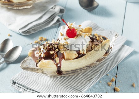Sweet Homemade Banana Split Sundae with Chocolate Vanilla  Strawberry Ice Cream Royalty-Free Stock Photo #664843732